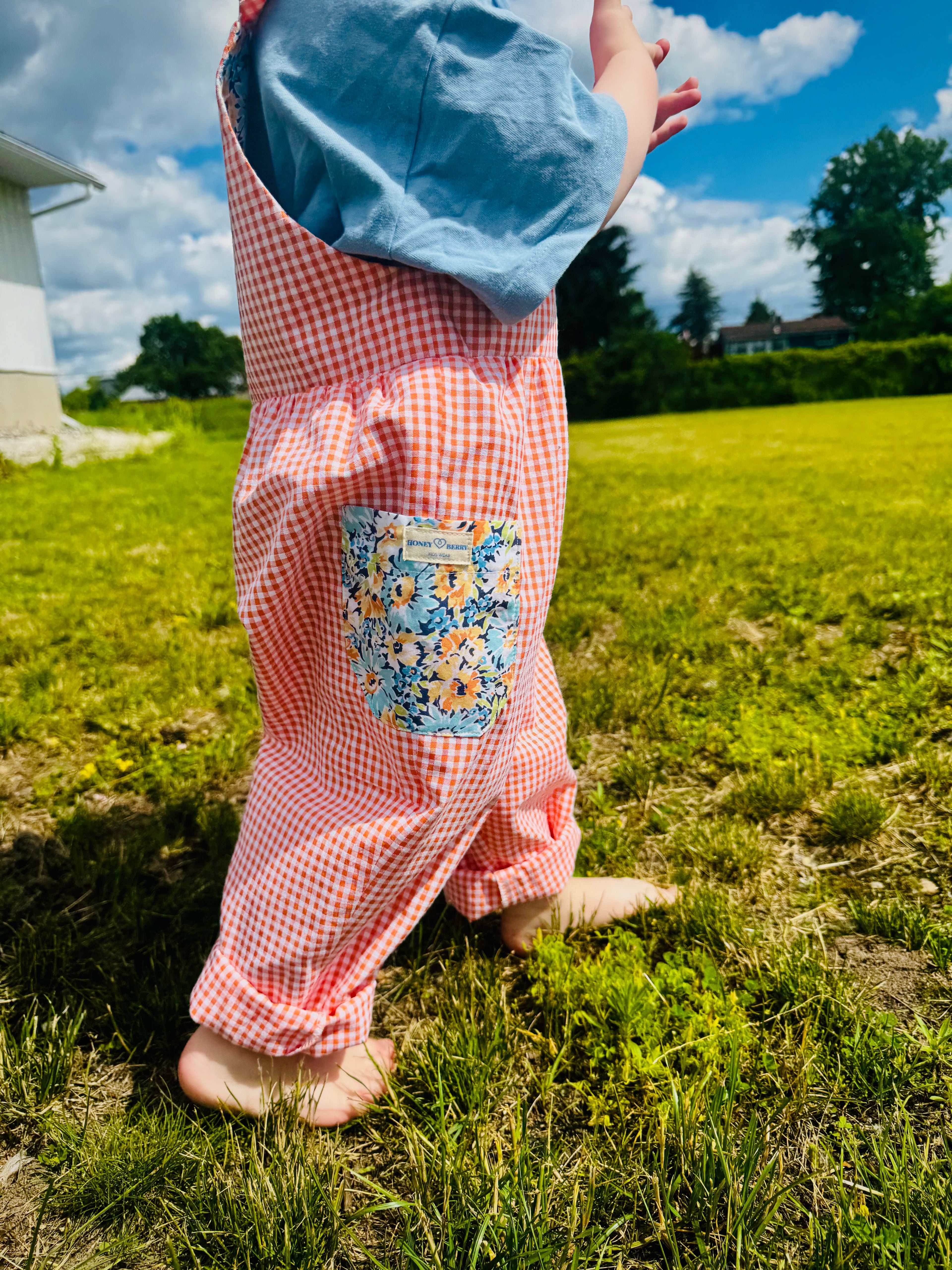 child walking in colourful pants